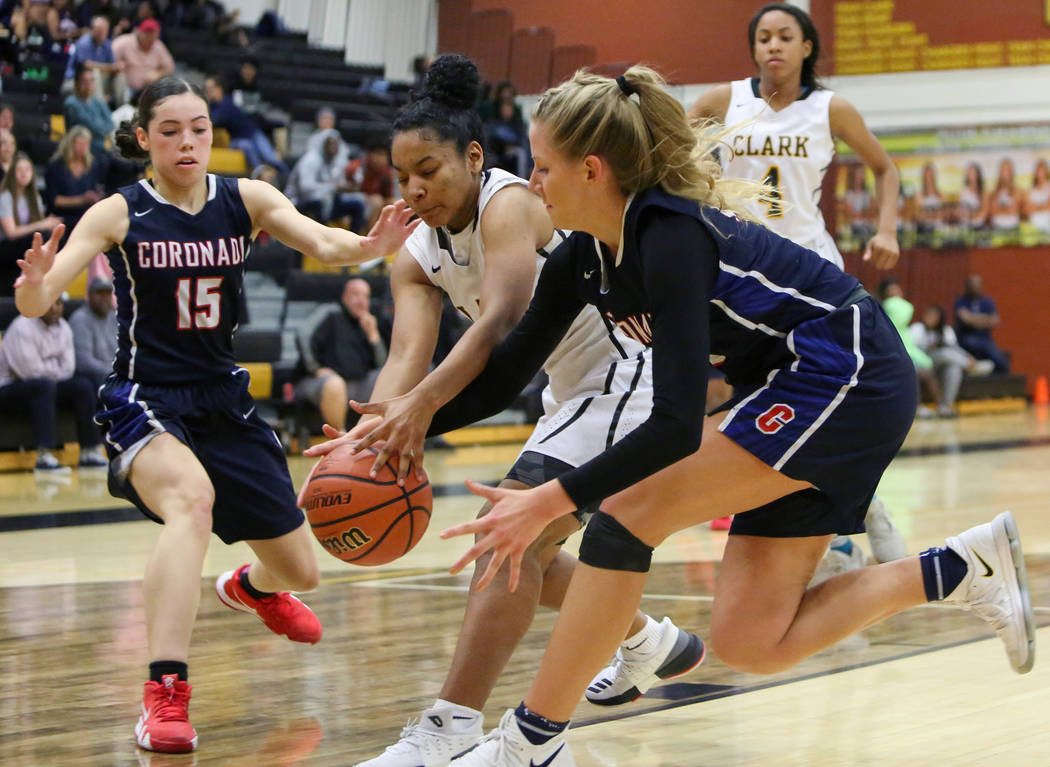 Clark’s Marieka Dent (3) reaches for the ball while under pressure from Coronado&#8217 ...