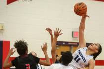 Canyon Springs’ Jeanette Fine (11) takes a shot during the second half of the Champion ...