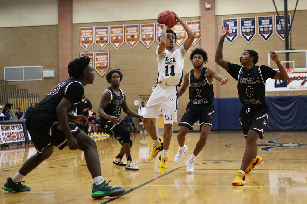 Democracy Prep’s Justous Harvey (11) goes up for a shot against Cimarron-Memorial in t ...