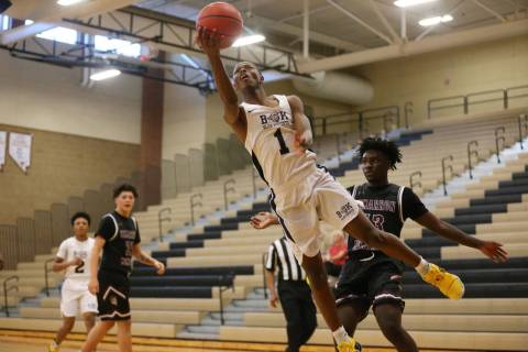 Democracy Prep’s Najeeb Muhammad (1) goes up for a shot against Cimarron-Memorial in t ...