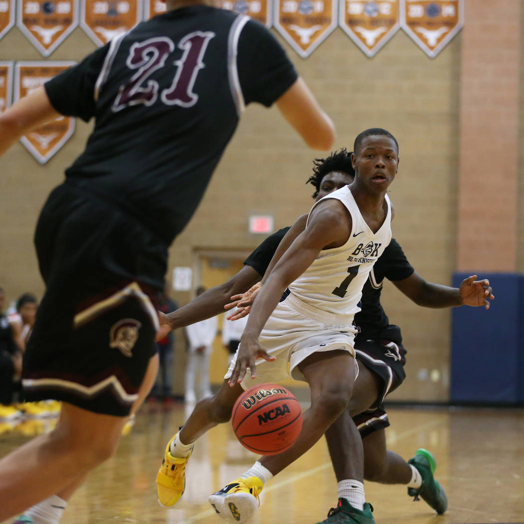 Democracy Prep’s Najeeb Muhammad (1) looks for a play against Cimarron-Memorial in the ...