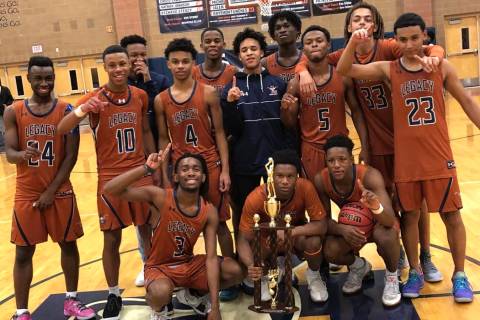 Legacy boys basketball players pose for a photo after a 57-54 victory over Democracy Prep in ...