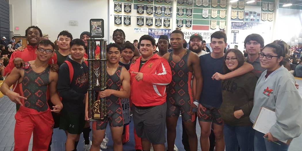 Mojave’s team surrounds Jayzen Cabbab (holding trophy) after Cabbab pinned Rancho&#821 ...