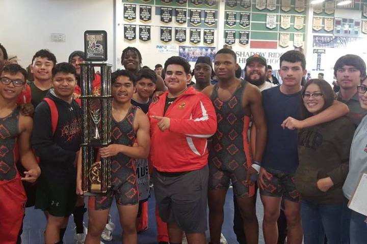Mojave’s team surrounds Jayzen Cabbab (holding trophy) after Cabbab pinned Rancho&#821 ...