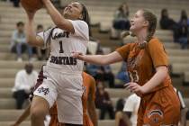 Cimarron-Memorial’s Elise Young (1) goes up for a shot against Legacy in the girls bas ...