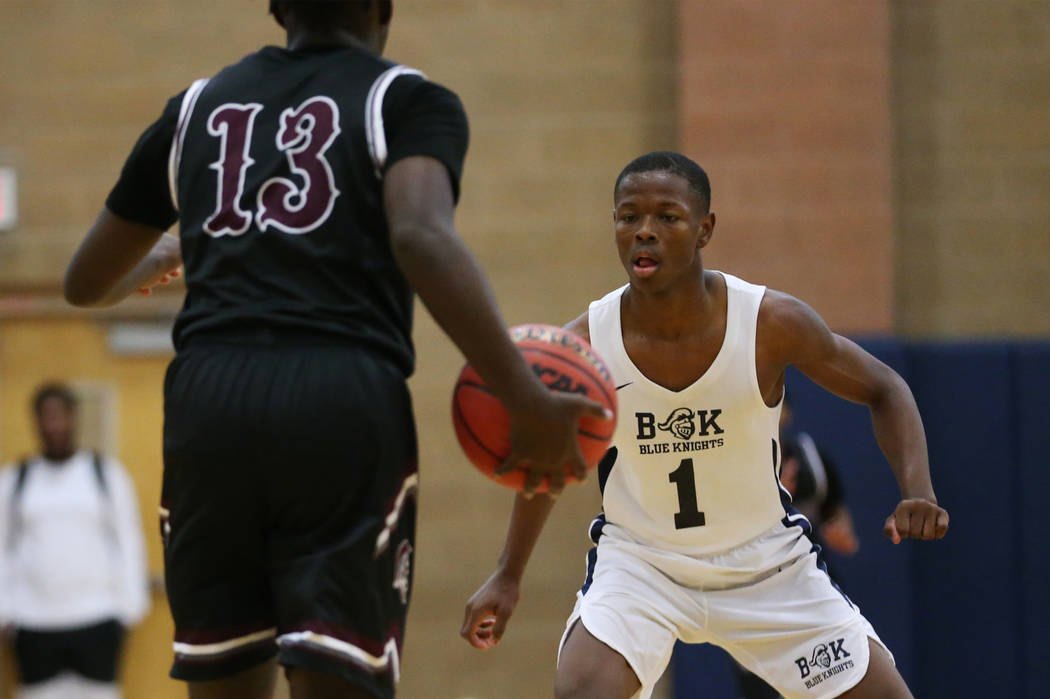 Democracy Prep’s Najeeb Muhammad (1) defends against Cimarron-Memorial’s Brian L ...