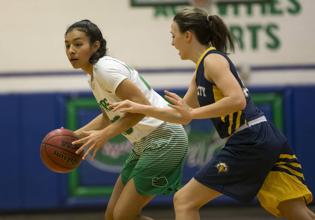 Green Valley’s Michelle Lagunas-Monroy (20) drives the ball against Boulder City guard ...