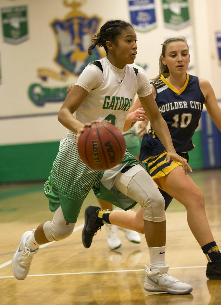 Green Valley’s Amore Espino (3) dribbles the ball against Boulder City’s Madison ...