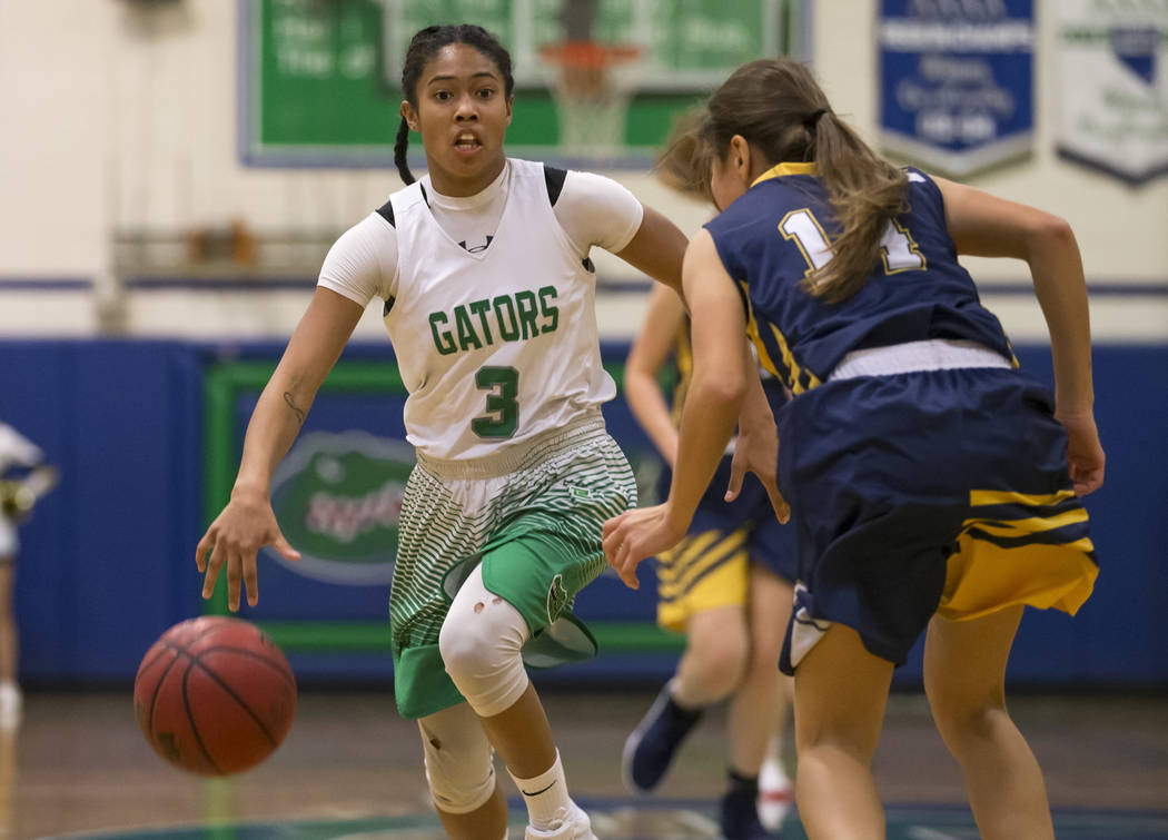 Green Valley’s Amore Espino (3) dribbles the ball against Boulder City’s Keely A ...