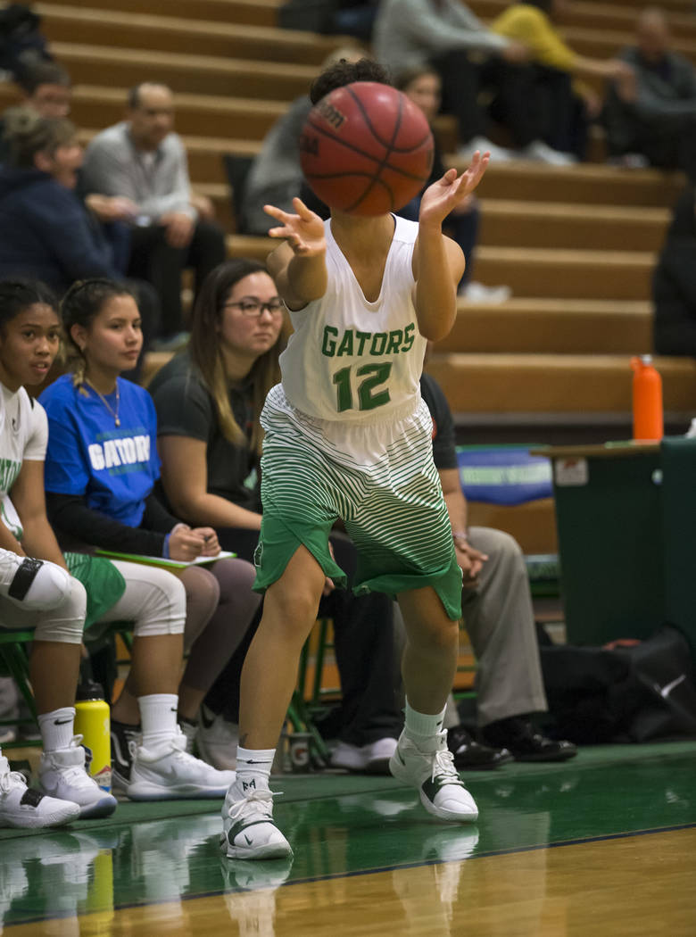 Green Valley’s Rian Anderson (12) passes the ball during the second half of a varsity ...