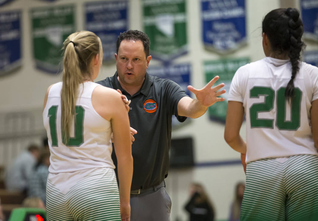 Green Valley’s head coach Rey White talks with Julia Clark (10) and Michelle Lagunas-M ...