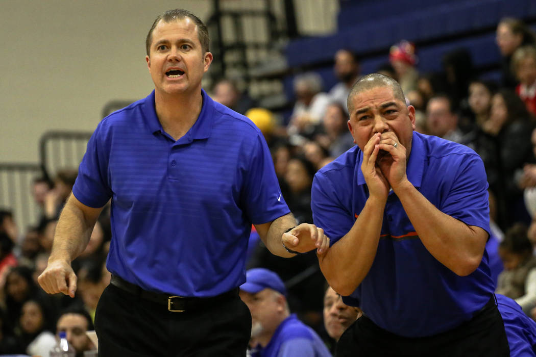 Bishop Gorman head coach Grant Rice, left, and assistant coach Rich Thornton react during th ...