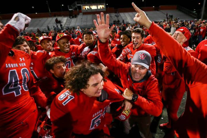 Arbor View head coach Dan Barnson, right, joins his players in celebrating their win over Fa ...