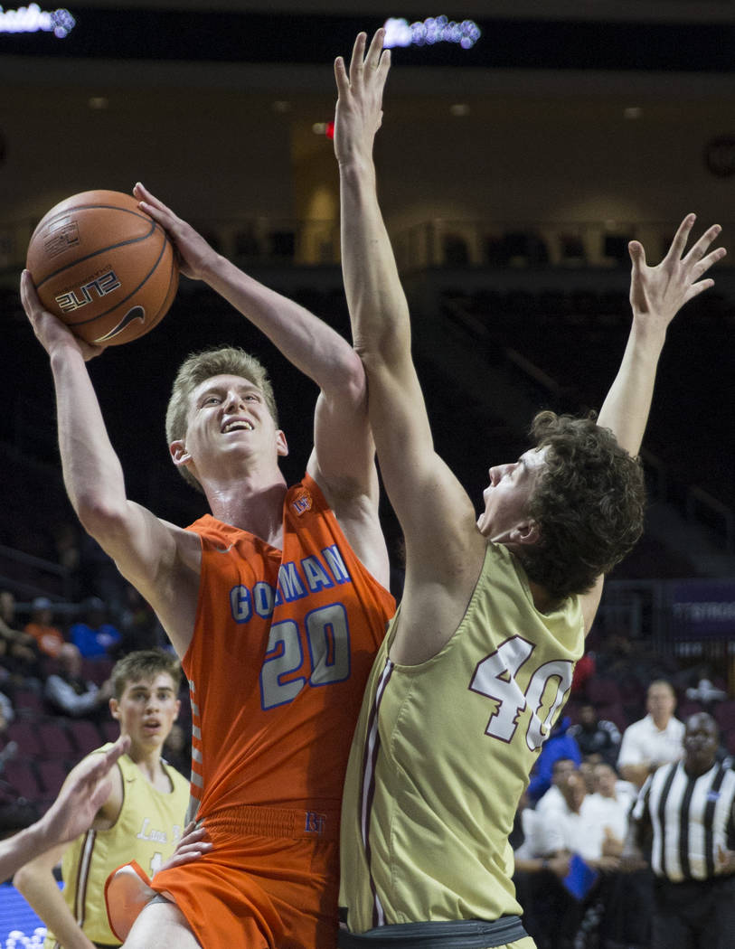 Bishop Gorman senior guard Noah Taitz (20) drives past Lone Peak sophomore center Cameron Br ...