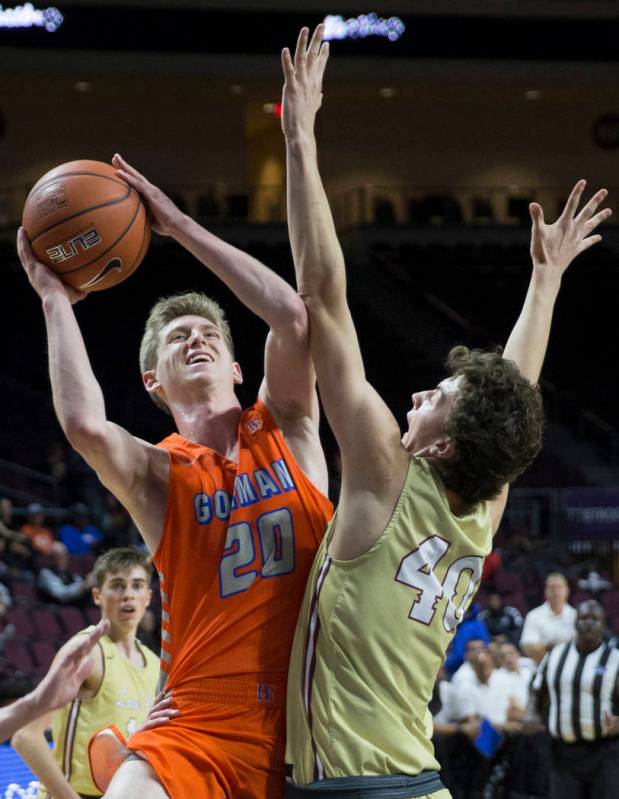 Bishop Gorman senior guard Noah Taitz (20) drives past Lone Peak sophomore center Cameron Br ...