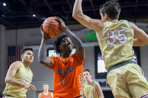 Bishop Gorman sophomore guard Will McClendon (1) elevates over Lone Peak junior guard Trey G ...