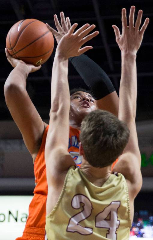 Bishop Gorman freshman forward Max Allen (12) shoots a jump shot over Lone Peak junior forwa ...