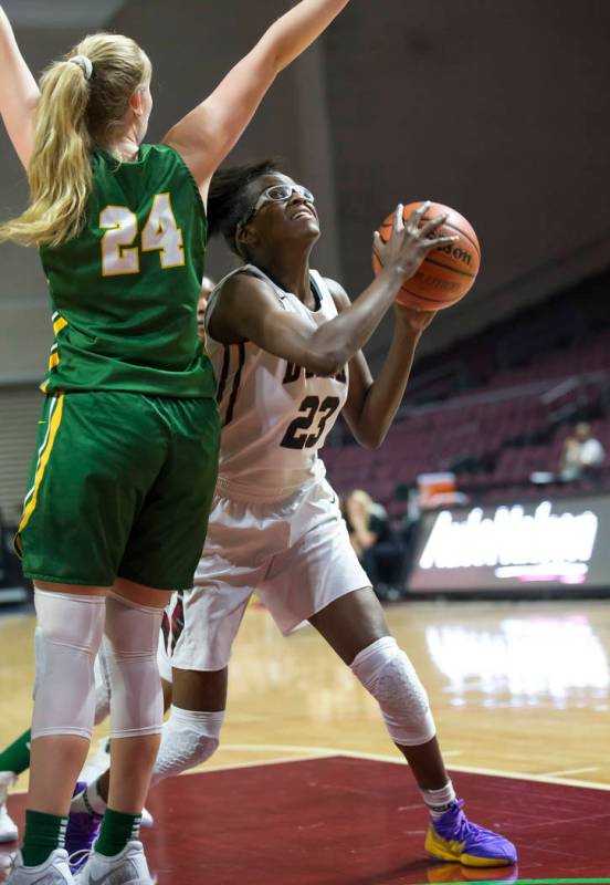 Desert Oasis’ Desi-rae Young (23) gets fouled by Brea Olinda’s Ashley Gustafson ...