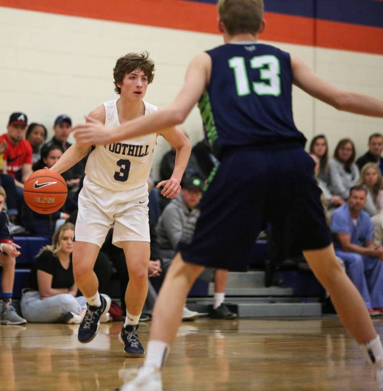 Foothill’s Collin Russell (3) dribbles the ball against Timpanogos’ Jackson Holc ...