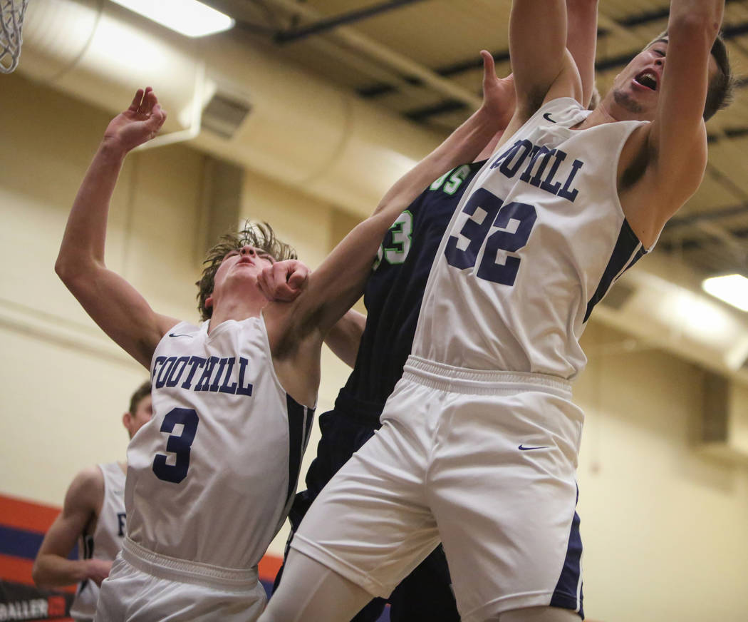 Foothill’s Collin Russell (3), left, Timpanogos’ Mckay Meeves (33) and Foothill& ...