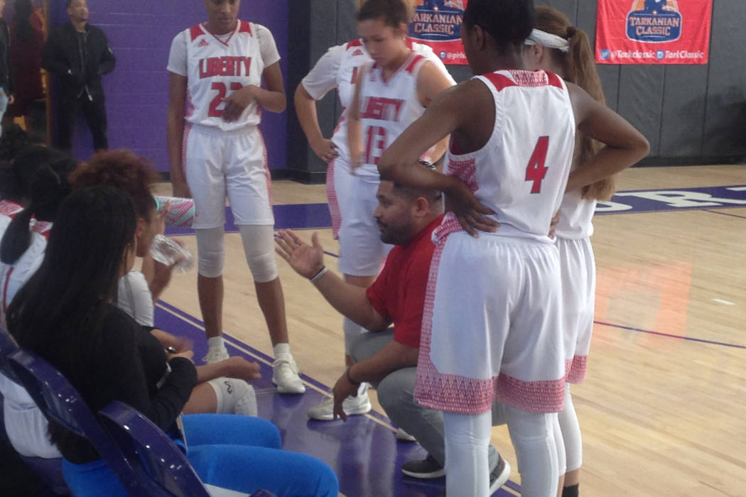 Liberty coach Chad Kapanui talks to his team during a timeout in their Ruby Division final a ...