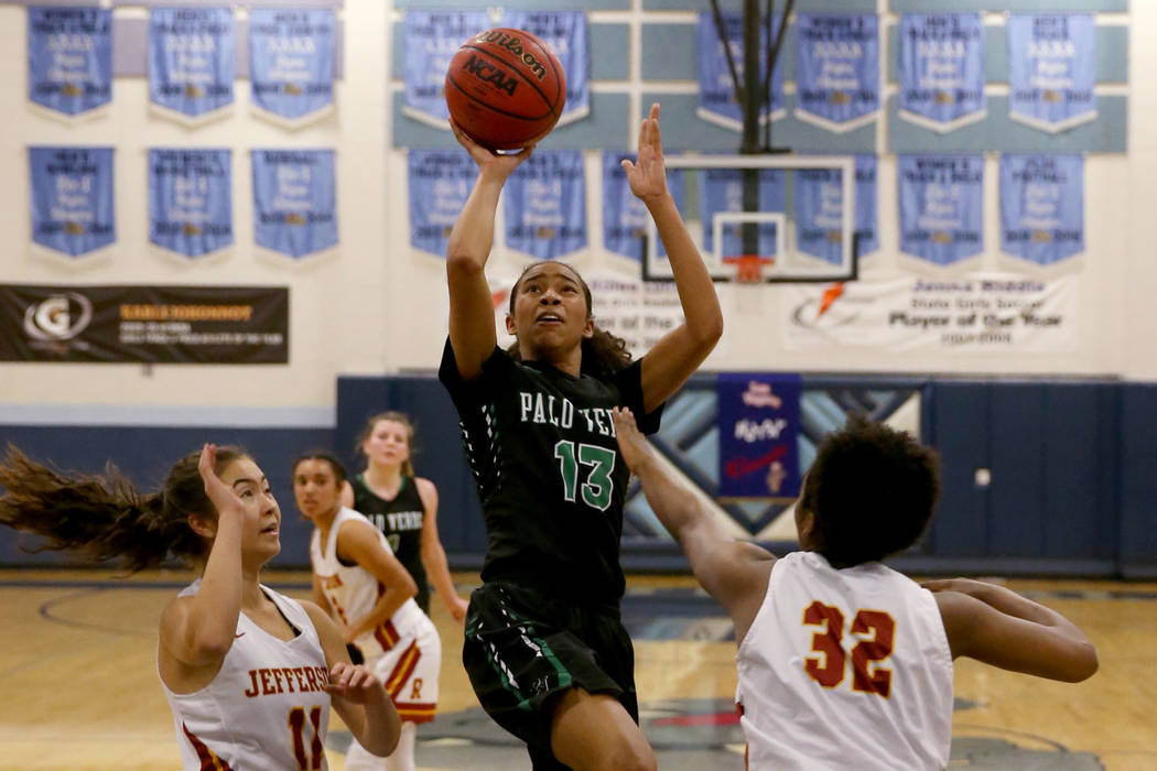 Palo Verde forward Kedrena Johnson (13) shoots between Thomas Jefferson (Wash.) guard Amy Ho ...