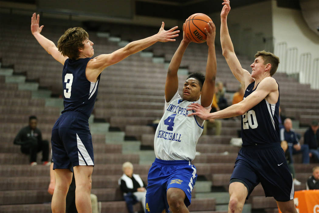 Trinity’s Jose Cuello (4) drives the ball under pressure from Foothill’s Collin ...