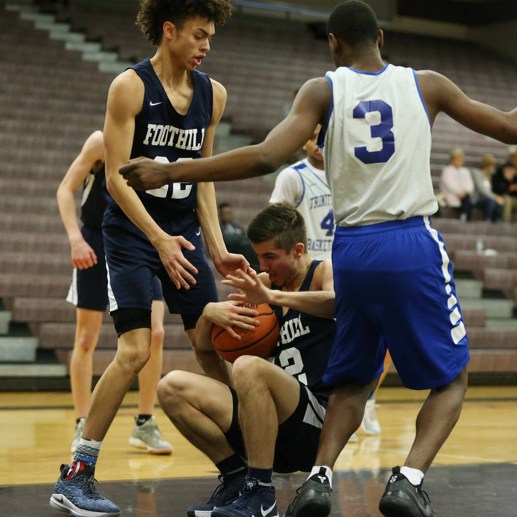 Foothill’s Dylan Hushaw (32), with teammate Jace Rocequemore (22), takes a fall under ...