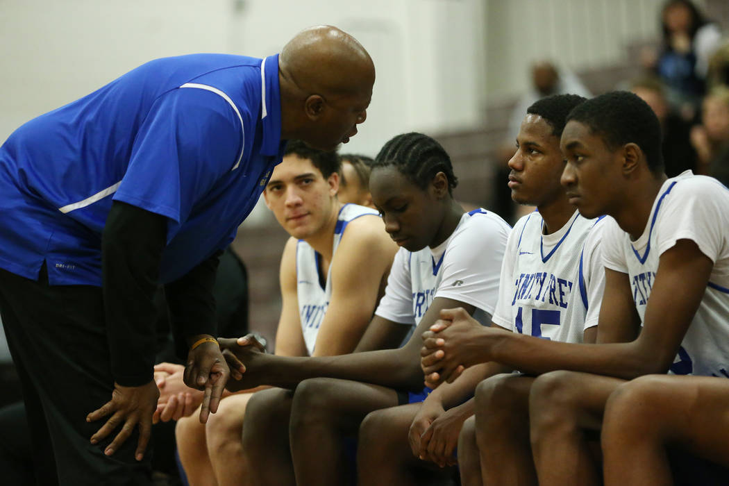 Foothill’s head coach Greg Lockridge talks to his player (15) Milton Burnett in the La ...