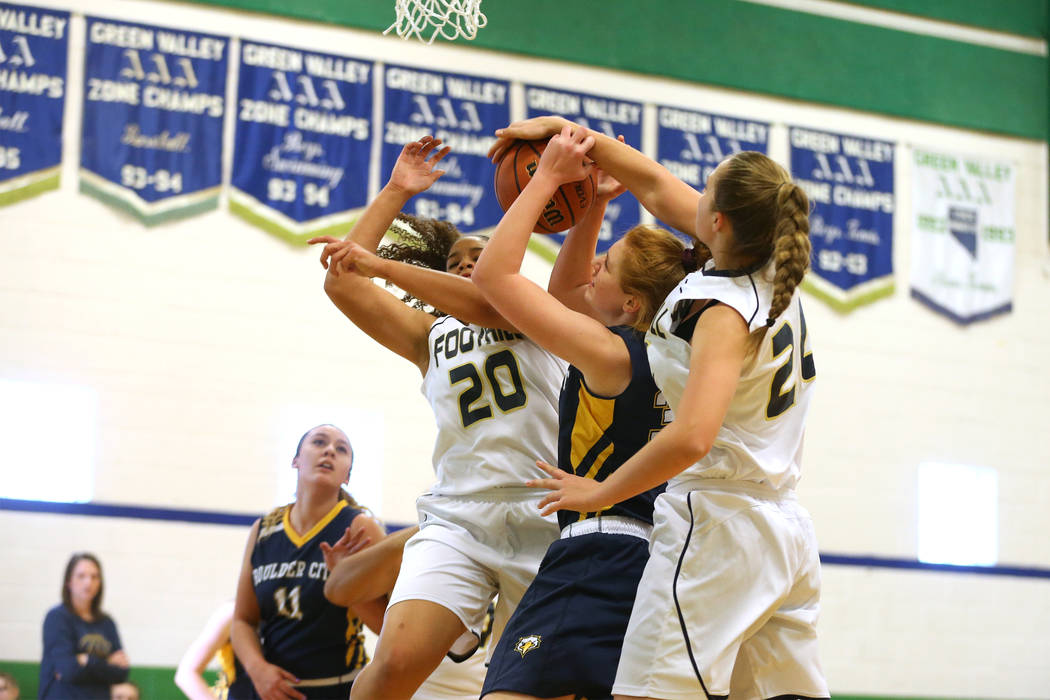 Boulder City’s Ellie Howard (33) gets blocked by Foothill’s Laurel Rockwood (24) ...