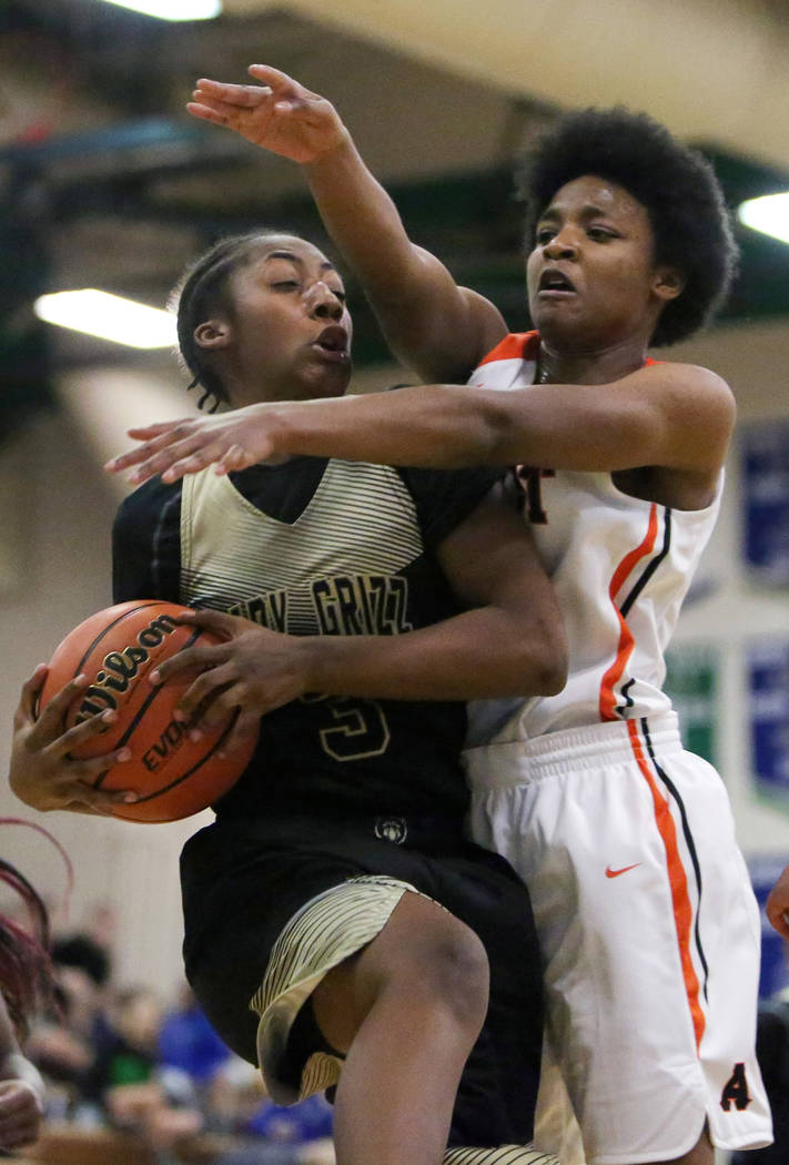 Spring Valley’s Aaliyah Gayles (3) shields the ball from West Anchorage’s Ah&#82 ...