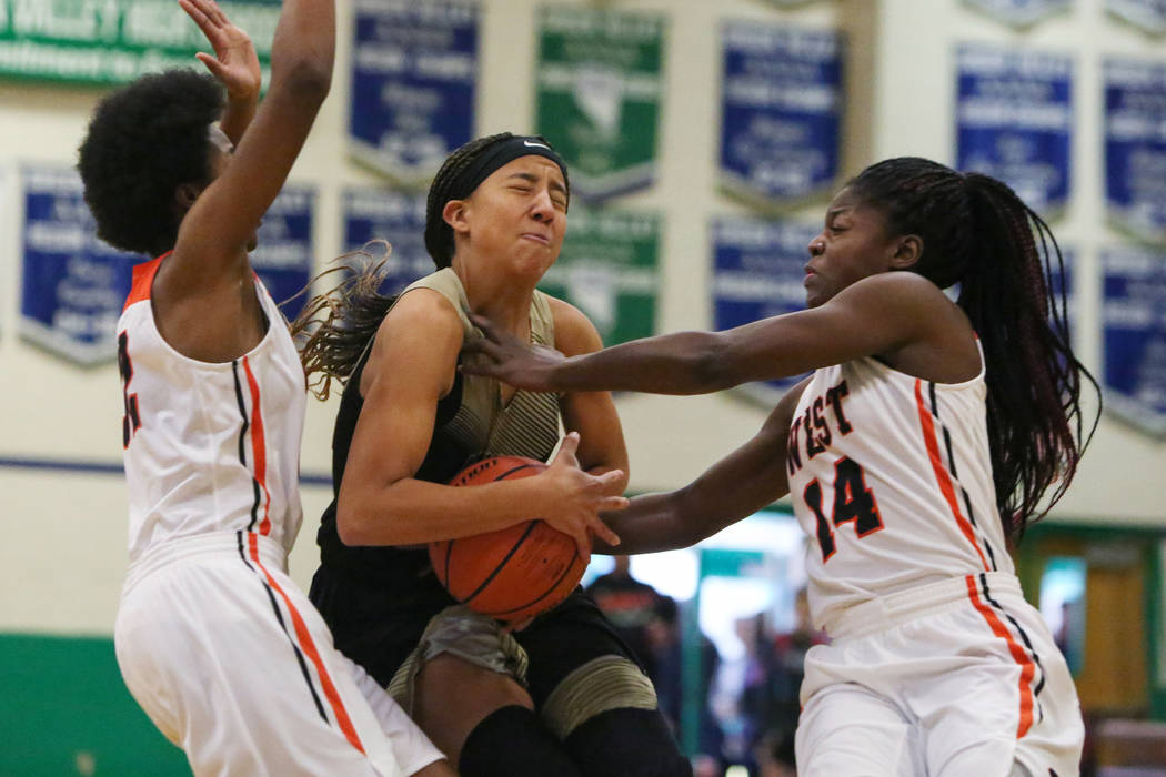 Spring Valley’s Garrisen Freeman (32) drives the ball past West Anchorage’s Ah&# ...