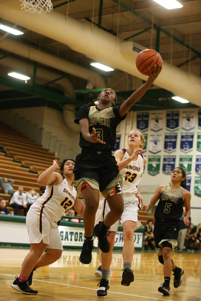 Spring Valley’s Aaliyah Gayles (3) takes a shot for a score against Dimond in the Diam ...