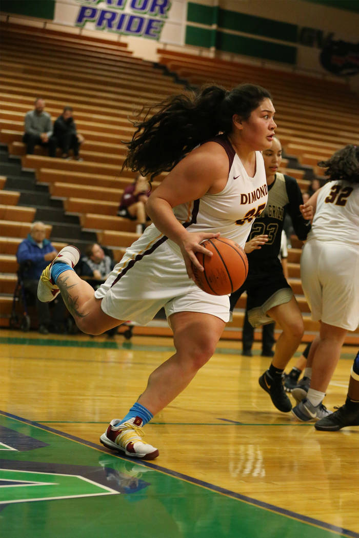Dimond’s Alissa Pili (35) looks for an open pass as she steps out of bounds against Sp ...