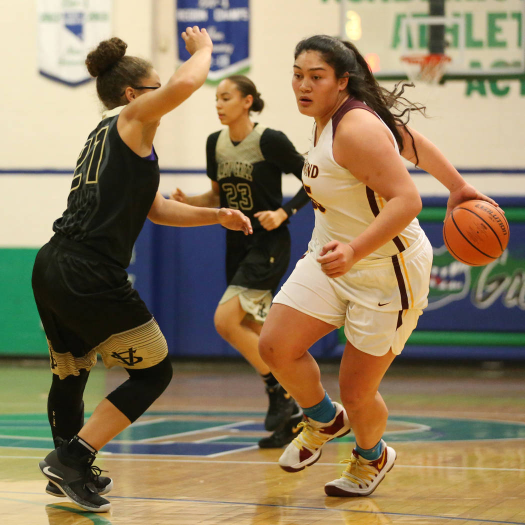 Dimond’s Alissa Pili (35) dribbles the ball around her back against Spring Valley&#821 ...