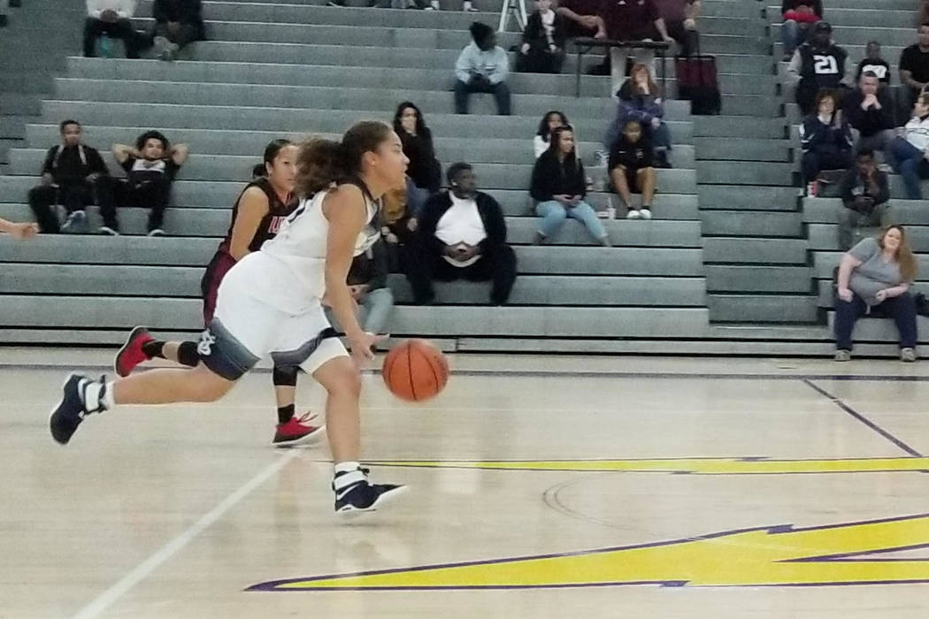 Spring Valley’s Ella Zanders races down the court against on Saturday against Liberty ...