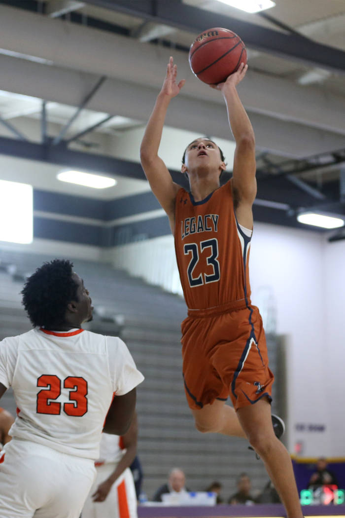 Legacy’s Andrew Garcia (23) goes up for a shot against Chaparral in the boy’s ba ...