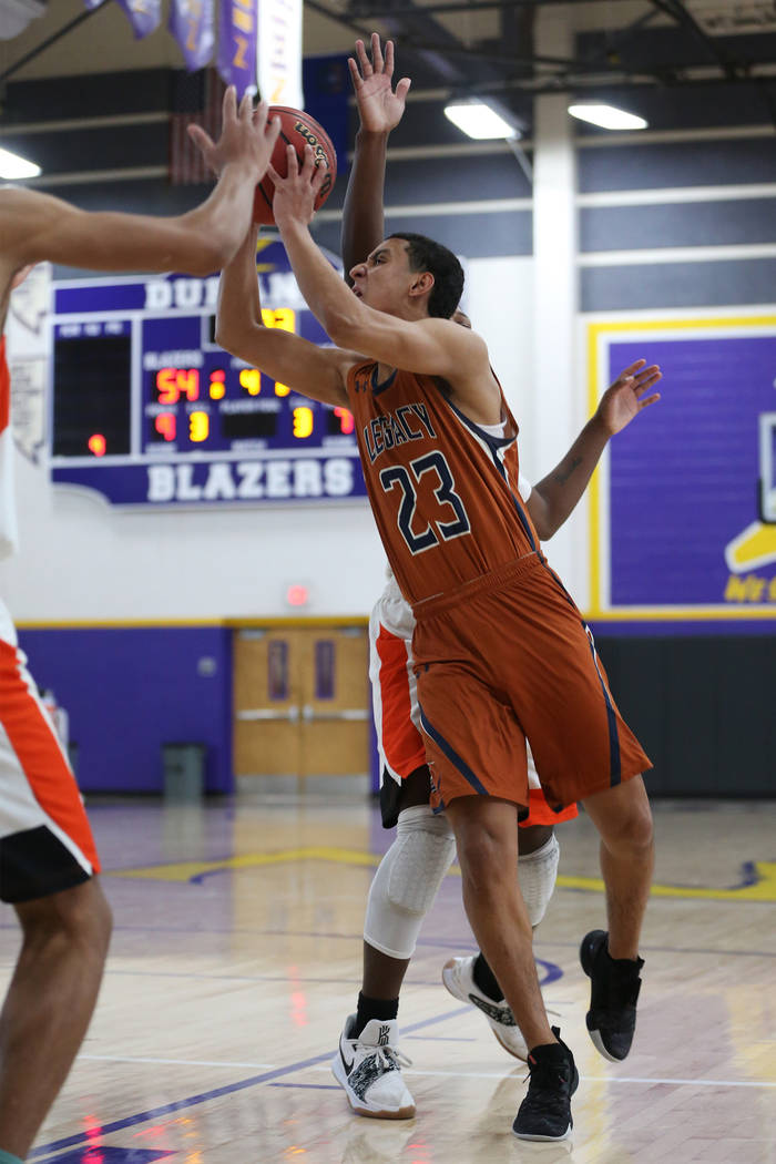 Legacy’s Andrew Garcia (23) goes up for a shot against Chaparral in the boy’s ba ...