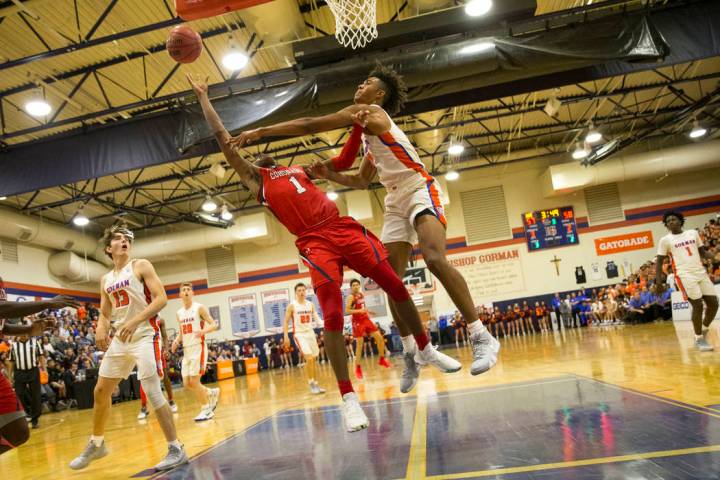 Coronado’s Jaden Hardy (1) gets blocked by Bishop Gorman’s Isaiah Cottrell (0) d ...