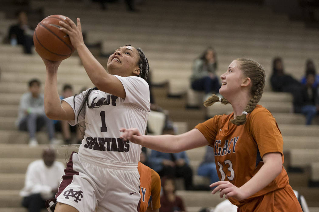Cimarron-Memorial’s Elise Young (1) goes up for a shot against Legacy in the girls bas ...