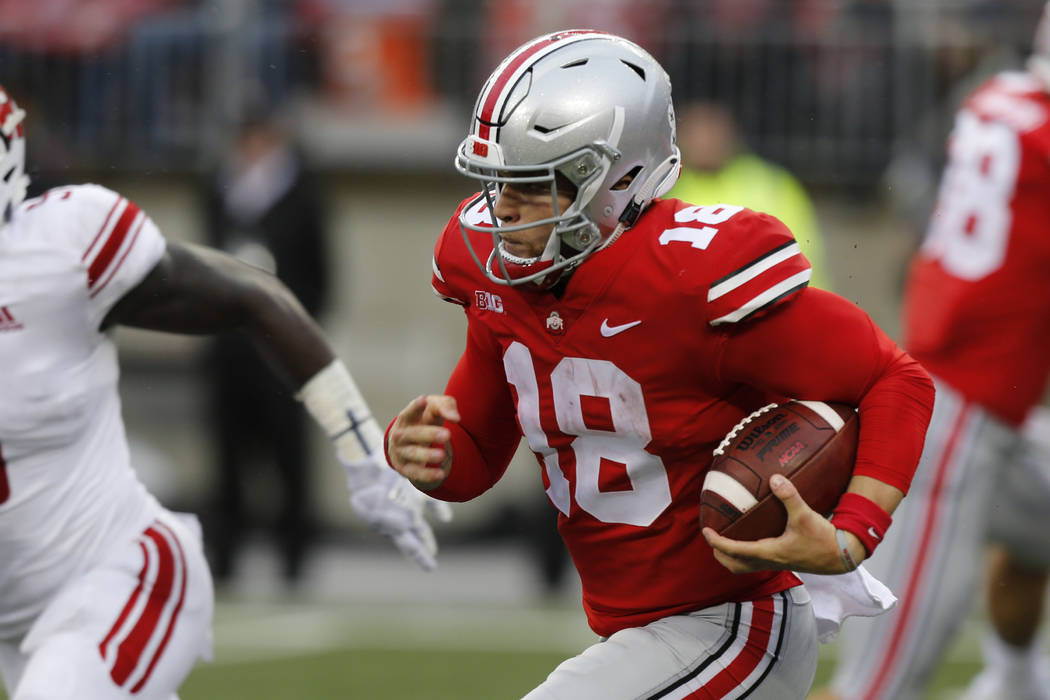 Ohio State quarterback Tate Martell plays against Rutgers during an NCAA college football ga ...