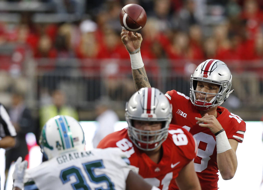 Ohio State quarterback Tate Martell throws a pass against Tulane during the second half of a ...