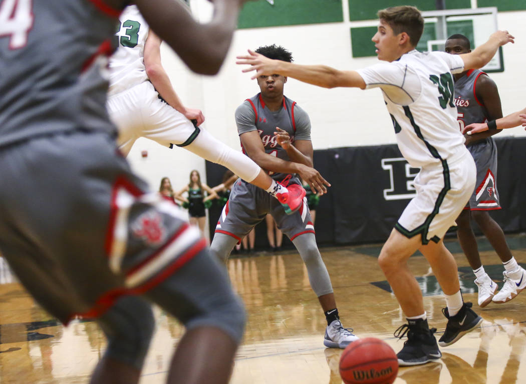 Arbor View’s guard Ziyon White (1) passes to a teammate during a basketball game at Pa ...