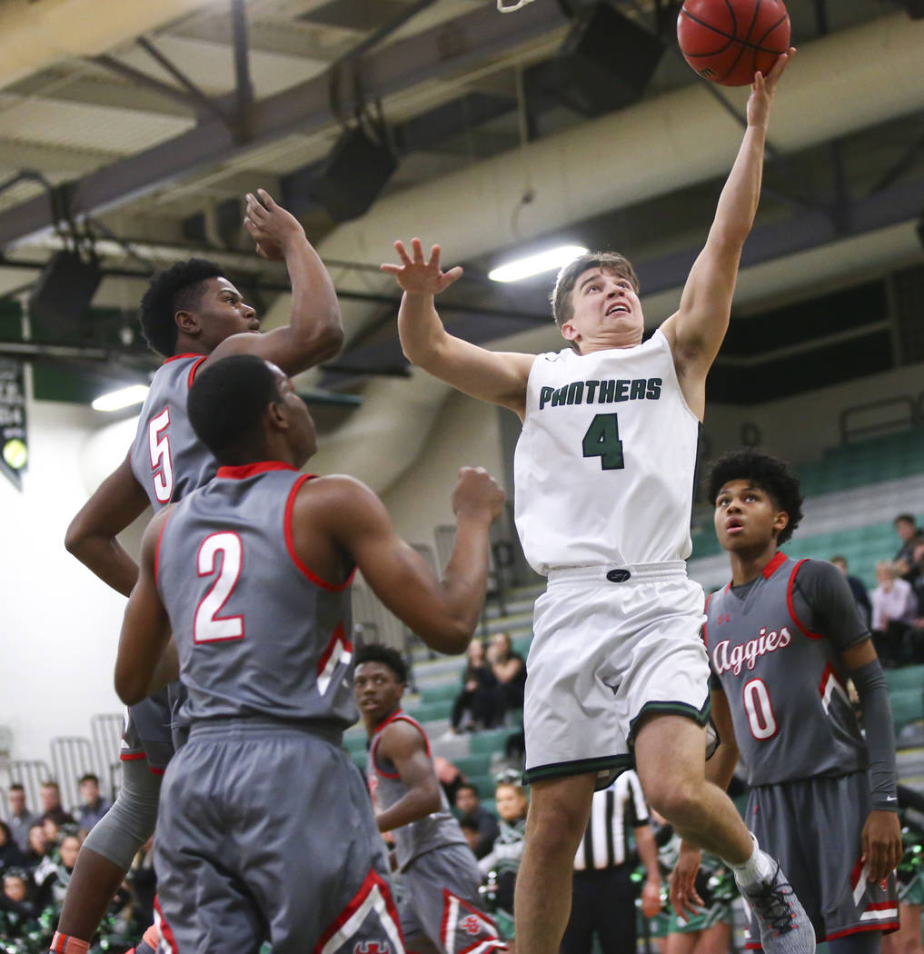 Palo Verde’s Antonio Maillaro (4) goes to the basket past Arbor View’s Favour Ch ...