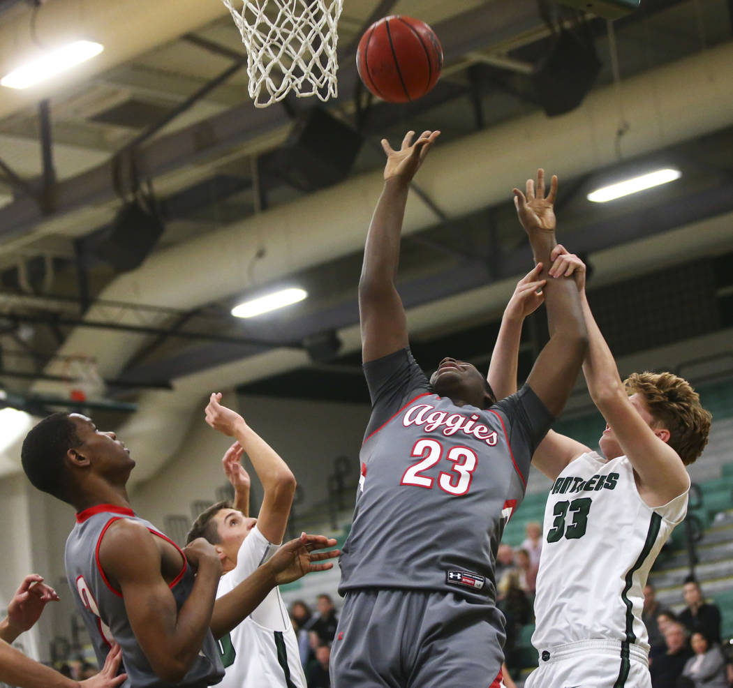 Arbor View’s Jaylon Lee (23) shoots against Palo Verde’s Sam Johnson (33) during ...