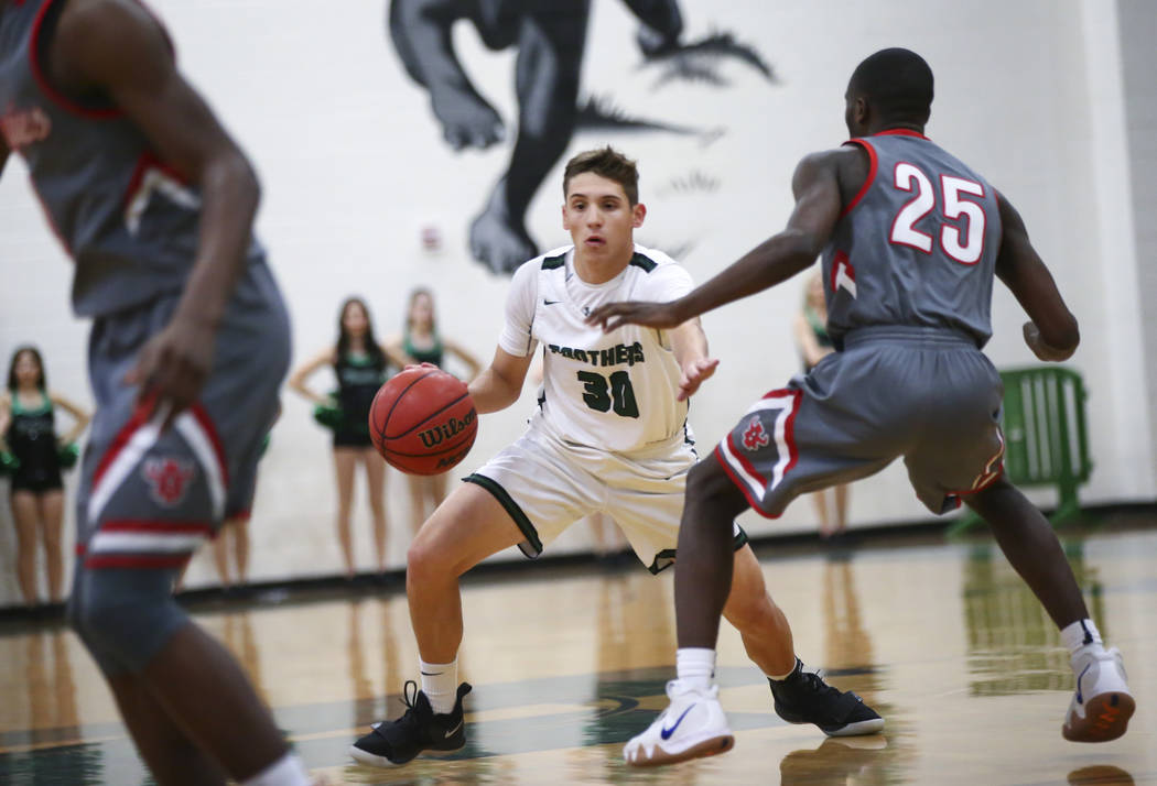 Palo Verde’s Drew Warnick (30) drives the ball against Arbor View’s Larry Holmes ...