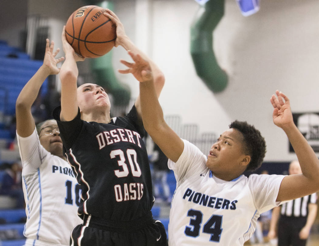 Desert Oasis senior forward Sierra Mich’l (30) drives baseline past Canyon Springs jun ...