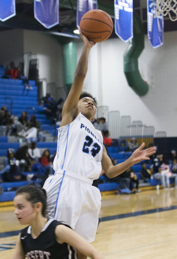 Canyon Springs senior guard Kayla Johnson (23) converts a fast break layup over Desert Oasis ...