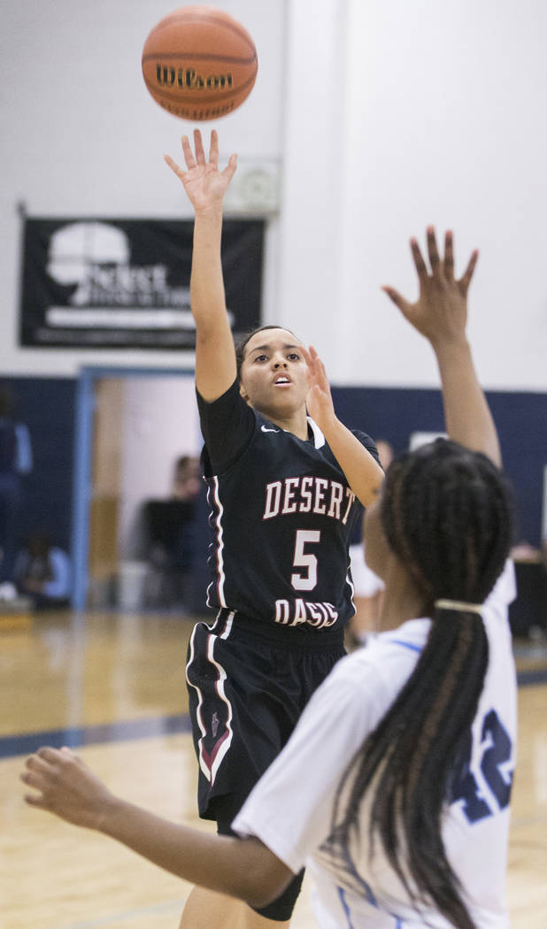Desert Oasis junior guard Eliyjah Pricebrooks (5) shoots a runner over Canyon Springs junior ...