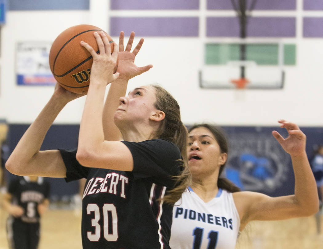 Desert Oasis senior forward Sierra Mich’l (30) drives baseline past Canyon Springs jun ...